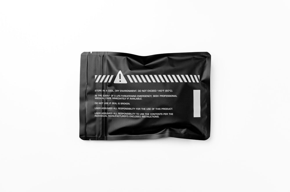 Personal Water Decon Kit back of black mylar pouch, flat-lay with warning triangle, hazard stripes and storage text
