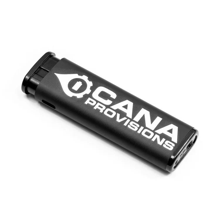 CANA MK Torch Pocket Lighter in matte black, three-quarter view with white CANA Provisions logo and gear-flame emblem